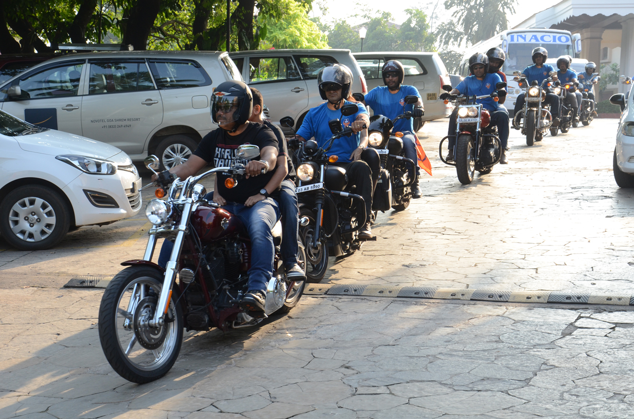 Harley Owners Group riders escort the FC Goa team bus to the stadium